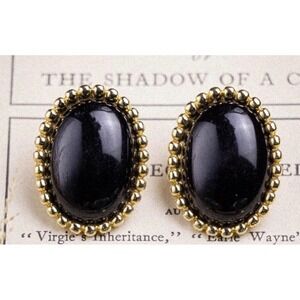 Vintage Monet earrings featuring beaded-edge oval faux black onyx